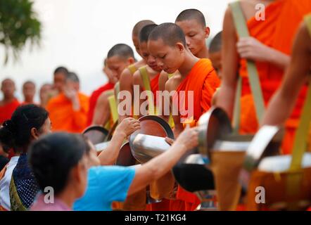 Beijing, China. 29th Mar, 2019. Photo taken on March 29, 2019 shows a scene of Tak Bat (Alms giving) in Luang Prabang, Laos. Tak Bat is a tradition in Laos Buddhist culture. Credit: Wang Jingqiang/Xinhua/Alamy Live News Stock Photo