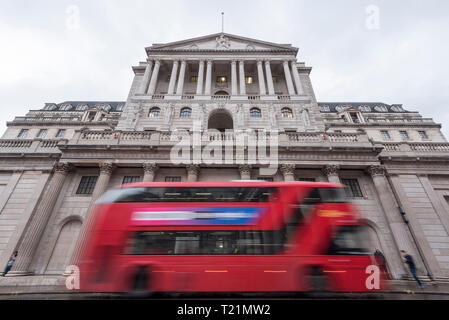 Beijing, China. 6th Mar, 2019. A double-decker red bus passes by the Bank of England in London, Britain on March 6, 2019. Credit: Stephen Chung/Xinhua/Alamy Live News Stock Photo