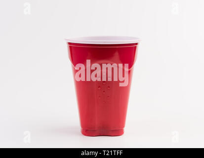 Empty red plastic cup isolated on white Stock Photo