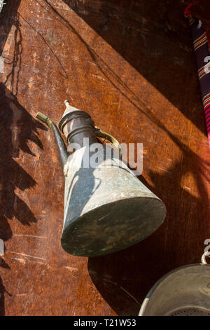Ancient metal jug in oriental style  in antique market Stock Photo