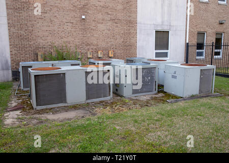 Group of mulitple air conditioner units outside commerical building Stock Photo