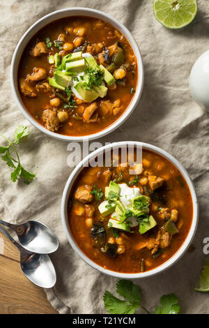 Homemade Mexican Pozole Soup with Chicken and Avocado Stock Photo