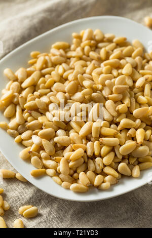 Raw Organic Pine Nuts in a Bowl Stock Photo