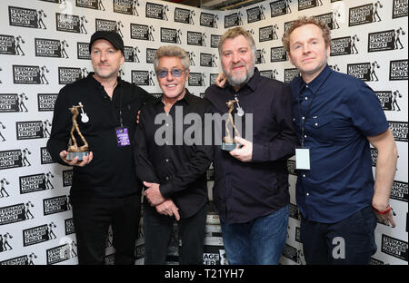 TCT's Honorary Patron Roger Daltrey CBE gives an award to Doves ahead of their performance during the Teenage Cancer Trust Concert, Royal Albert Hall, London. Stock Photo