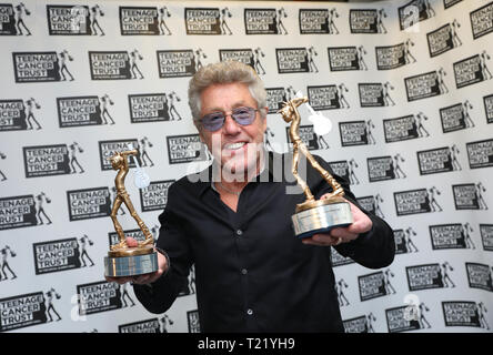 TCT's Honorary Patron Roger Daltrey CBE holds two TCT awards ahead of Doves performance during the Teenage Cancer Trust Concert, Royal Albert Hall, London. Stock Photo