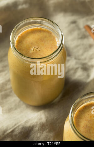 Homemade Warm Turmeric Golden Milk in a Glass Stock Photo