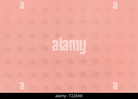 Metallic background texture with pyramid shaped knobs copy space toned in trend color Living Coral. Stock Photo