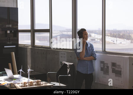 Male architect talking on mobile phone in a modern office Stock Photo