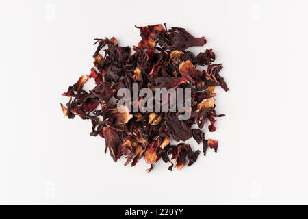 petals of dry hibiscus tea isolated on white background, top view Stock Photo