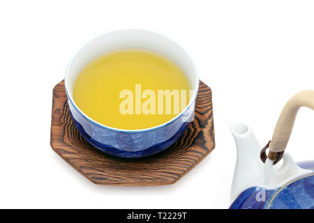 Japanese green tea with cup isolated on a white background Stock Photo