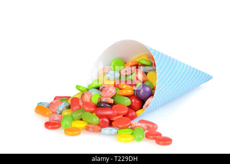 spilled mix candy from a blue paper cone Stock Photo