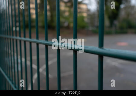 Depth of field view of fencing. Urban city park in germany Stock Photo