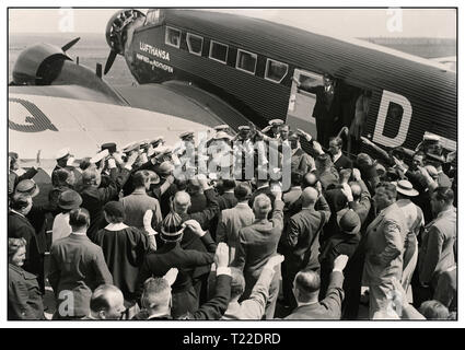 Vintage 1930's pre-war B&W image of Hermann Göring leading German Nazi and head of the German Luftwaffe arriving in Hungary 'Mátyásföldön' in a German Junkers Ju 52 with 'Lufthansa' insignia on fuselage Crowd greet him with Heil Hitler salutes 1935 Stock Photo