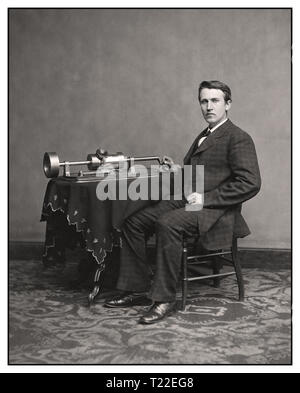 Thomas Edison and his early phonograph. circa 1877 “Thomas A. Edison.” On Nov 21, 1877, Thomas Edison introduced his phonograph machine to the world, a brilliant device to record and playback sound. The sound vibrations of his voice would be indented onto the cylinder by the recording needle.. Stock Photo