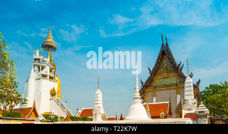 Beautifully decorated stupas at Wat Intharawihan temple, Bangkok, Thailand. Traditional religious architecture, one of the main attractions on Bangkok Stock Photo