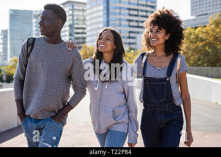 Three friends spending time in the city Stock Photo