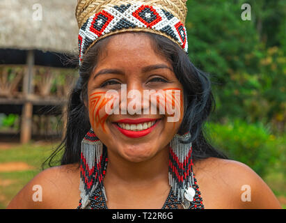 Portrait of a smiling indigenous Embera woman in her village inside the rainforest of Panama, Darien Jungle, Central America. Stock Photo