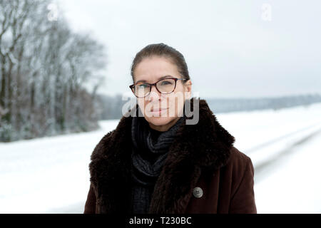 Portrait of mature woman in winter Stock Photo
