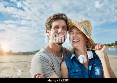 Happy young couple on the beach Stock Photo