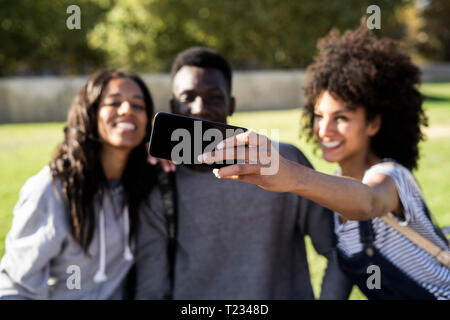 Three friends spending time in the city Stock Photo