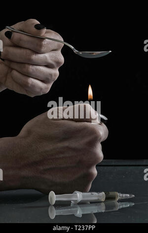 Heating heroin in spoon. Stock Photo