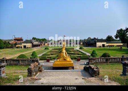 Golden dragon in Imperial City, Hue, Vietnam. Royal Palace in the background. Stock Photo