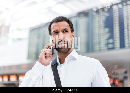 Businessman using smartphone Stock Photo