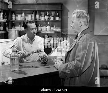 The Night My Number Came Up (1955)  Yah Ming, Alexander Knox,     Date: 1955 Stock Photo