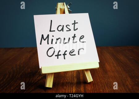 Last minute offer written on piece of paper. Stock Photo