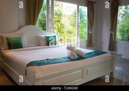 Thailand, spacious bedroom with double bed in luxury hotel Stock Photo