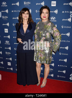 BEVERLY HILLS, CA - MARCH 28: Gina Gershon (L) and Jennifer Tilly attend the 30th Annual GLAAD Media Awards at The Beverly Hilton Hotel on March 28, 2019 in Beverly Hills, California. Stock Photo