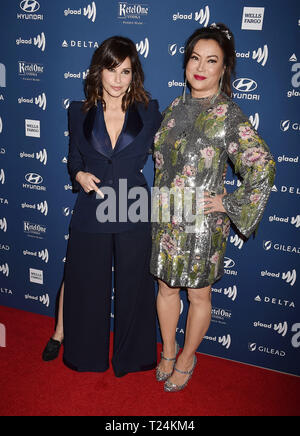 BEVERLY HILLS, CA - MARCH 28: Gina Gershon (L) and Jennifer Tilly attend the 30th Annual GLAAD Media Awards at The Beverly Hilton Hotel on March 28, 2019 in Beverly Hills, California. Stock Photo