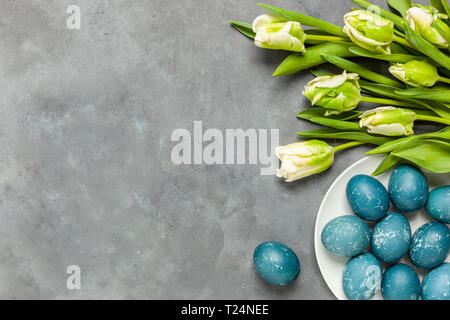 Easter composition on gray textured background with space for text. Gray background - concrete structure Stock Photo