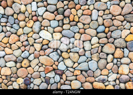 Colorful pebble stone wall texture Stock Photo