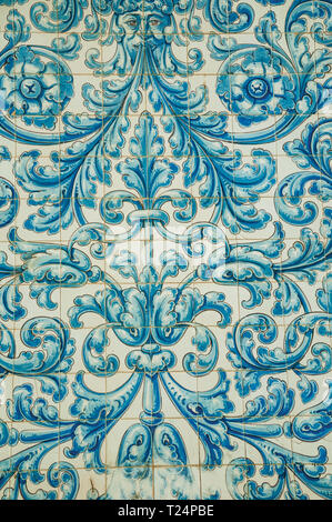 Blue floral pattern hand-painted on ceramic tiles in an old building of Caceres. A charming town with a fully preserved old city center in Spain. Stock Photo