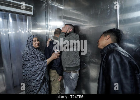 Family members to the deceased are seen mourning at the hospital morgue. The family of Adham Emara, 17 who was killed during clashes with Israeli forces near the border with Israel seen at the hospital morgue in Beit Lahia to confirm the identity of the body. Stock Photo