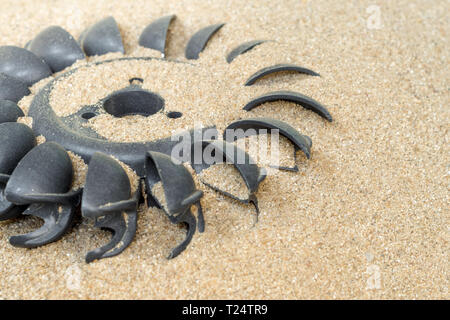 Old water turbine on dried sand without water, useless in drought condition Stock Photo