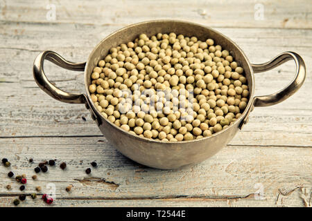 Dried Peas in Cooking Pot with Pepper Stock Photo