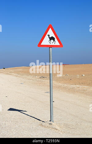 camel crossing sign in the desert Stock Photo