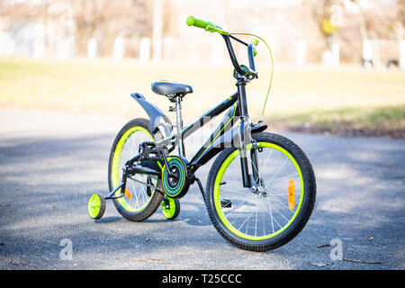 green bicycle for children on park background. children's transport Stock Photo
