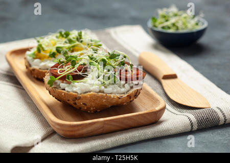 Sandwiches with radish sprouts and red lentil pate Stock Photo