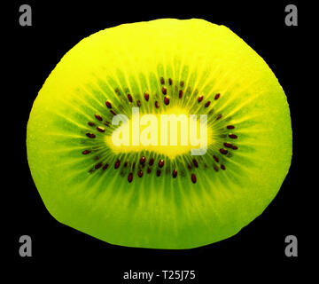 closeup of a kiwi fruit inside with seeds on dark background Stock Photo