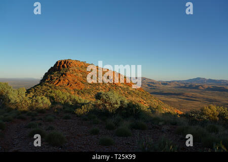 Hiker at the top of Mount Gillen just outside Alice Springs in central Australia. Stock Photo