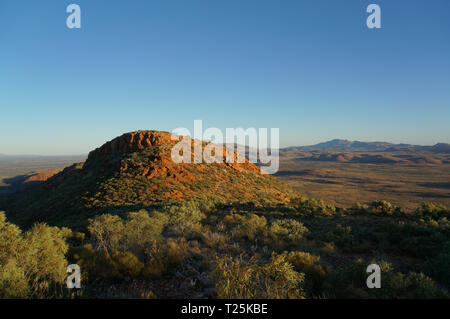 Hiker at the top of Mount Gillen just outside Alice Springs in central Australia. Stock Photo