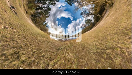 Little planet transformation with curvature of space. Spherical aerial 360 view panorama on the shore of lake in sunny summer with awesome clouds. Stock Photo