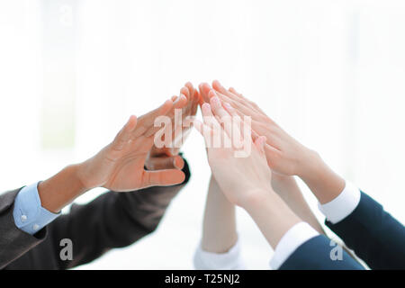 closeup.business team giving each other a high five. Stock Photo