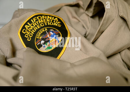 California Department of Corrections uniform patch; logo on correctional officer uniform; correctional officers. Stock Photo