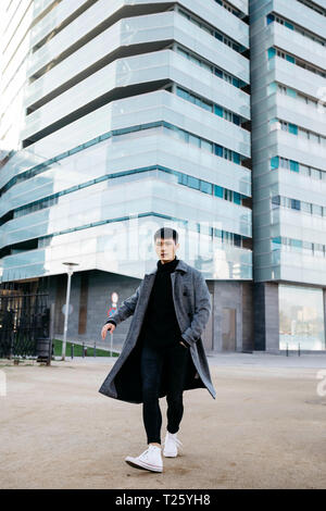 Spain, Barcelona, stylish young man posing on the street Stock Photo
