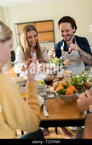 Friends having fun, eating lunch together Stock Photo