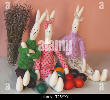 Two Easter bunny with colorful painted eggs. Stock Photo